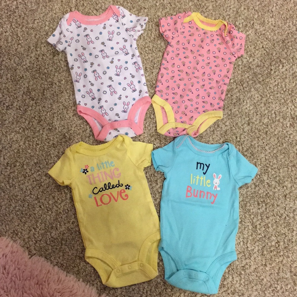 Four baby girl onesies